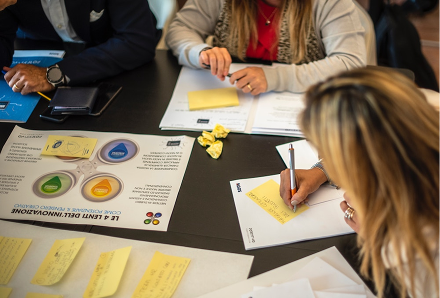 Participants working together around a table during a workshop